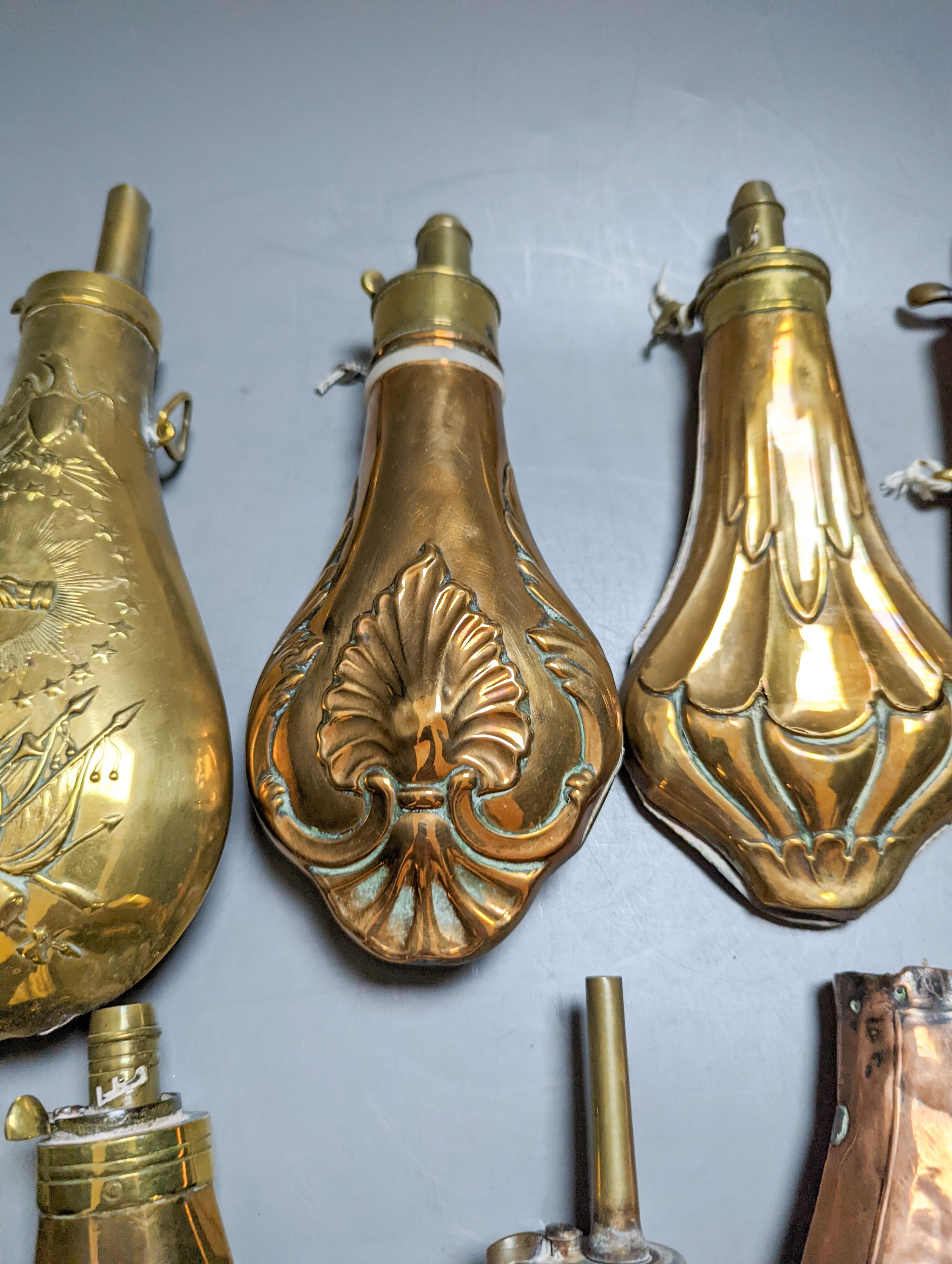 Eight assorted 19th century copper shot flasks